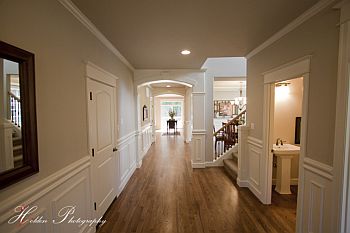 Photo of staged great room in the Martin home plan, first of four slides